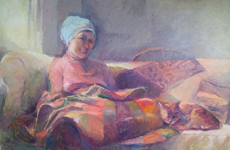 on sofa with ginger cat