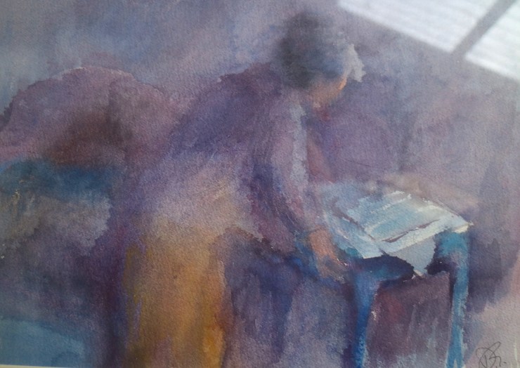 Woamn bends to read-WC